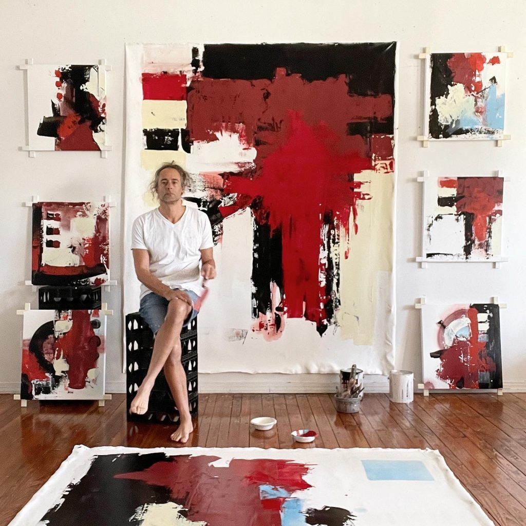 Jordan Betten with the painting Primal Red